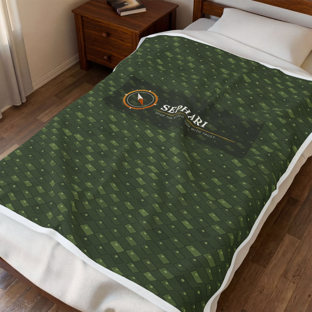 Sephari compass green throw blanket draped over furniture in a living room setting